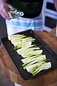Sprinkling fennel with oil