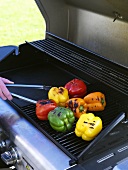 Whole peppers on a barbecue