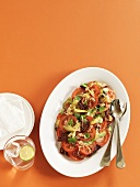 Tomato salad with gherkins and basil