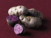 Purple potatoes, whole and halved