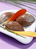 Chocolate shells with orange and cardamom filling