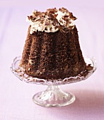 Chocolate cake with whipped cream and chocolate shavings