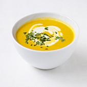 Cream of carrot soup with cream and herbs