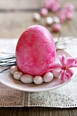 Pink Easter egg with sugar eggs