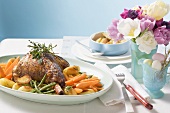 Roast lamb shank with herbs and vegetables