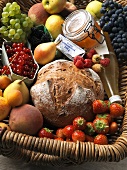 Fruit, bread, butter and honey in basket