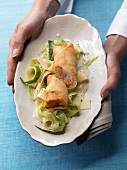 Fish spring roll on leeks and noodles