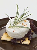 Goat's cheese and rosemary on cracker
