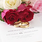 Wedding menu, wedding rings and roses