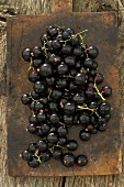 Blackcurrants on old chopping board