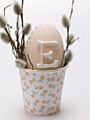 Sugar egg and pussy willow in a beaker