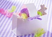 Easter egg and Easter Bunny biscuit in paper basket