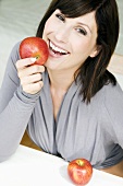 Woman holding an apple in her hand