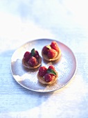 Three small raspberry tartlets