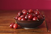 Red gooseberries in bowl