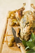 Stuffed chicken and potatoes on board