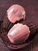 Chocolate madeleines with strawberry icing (France)