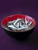 Fresh anchovies in lacquer bowl