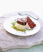 Beef fillet on mashed potato with braised cherry tomatoes