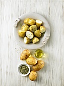 Potatoes sprinkled with olive oil & herbs ready for grilling