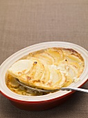 Potato and parsnip gratin in a dish