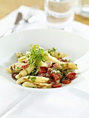 Penne with rocket, diced tomato and Parmesan