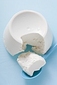 Ricotta with a piece broken off