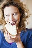 Woman eating bread and butter