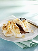 Chocolate ice cream with vanilla meringue and flaked almonds