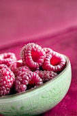 Fresh raspberries in a ceramic bowl