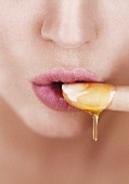 Woman tasting honey