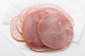 Slices of ham on paper