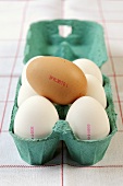 Eggs with quality stamp in an egg box
