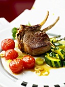 Lamb chop with courgettes and tomatoes