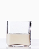 Oat milk in a square glass