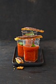 Gazpacho in three glasses with anchovy crostini