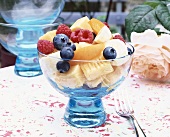 Fresh fruit salad in a blue glass bowl