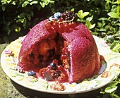 Summer pudding (soft fruit encased in bread, England)