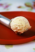 A scoop of vanilla and strawberry ice cream