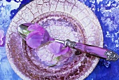 Plate with spoon and flowers