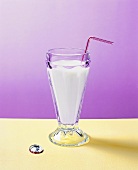 A milkshake with a straw