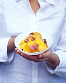 Poached peaches with cloves and cinnamon sticks