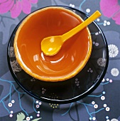 Orange bowl and spoon