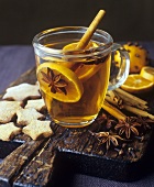 Grog with orange slices and spices, star-shaped biscuits