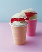 Lemon and berry sorbets in two paper cups