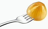Pickled onion on a fork