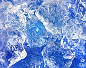 Crushed ice on blue background