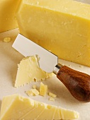 Cheddar cheese with cheese knife