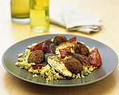 Falafel (store-bought product) with courgettes on couscous