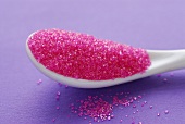 Pink sugar on a spoon